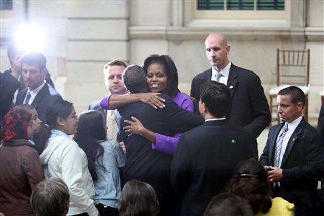 Michelle Obama hugs New York City councilman Robert Jackson.
